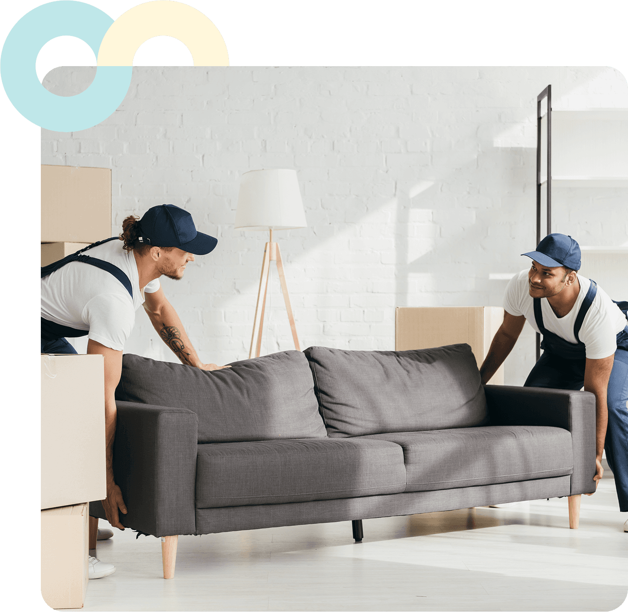 Two movers carrying a sofa