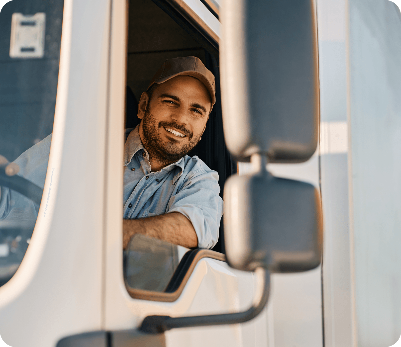 Person driving a truck and smiling